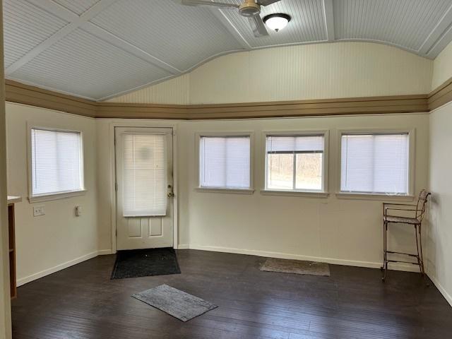 entryway featuring dark hardwood / wood-style flooring, vaulted ceiling, and ceiling fan