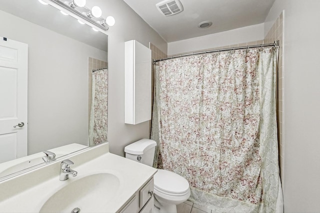 bathroom with vanity, toilet, and a shower with shower curtain