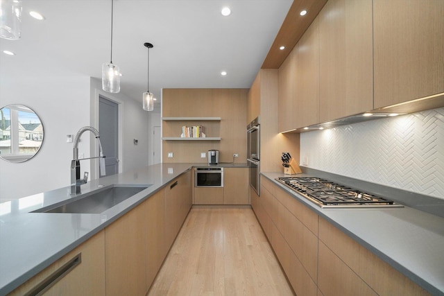 1834 N Rockwell St Unit 1R, Chicago, IL 60647 - kitchen featuring a sink, modern cabinets, stainless steel appliances, light wood-type flooring, and light brown cabinets