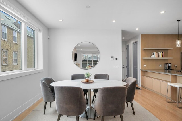1834 N Rockwell St Unit 1R, Chicago, IL 60647 - dining space with light wood finished floors, recessed lighting, built in features, and baseboards