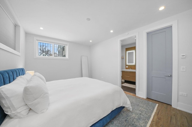 1834 N Rockwell St Unit 1R, Chicago, IL 60647 - bedroom featuring wood finished floors, recessed lighting, a sink, connected bathroom, and baseboards