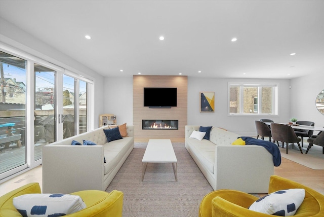1834 N Rockwell St Unit 1R, Chicago, IL 60647 - living area featuring recessed lighting, plenty of natural light, a large fireplace, and light wood-style flooring