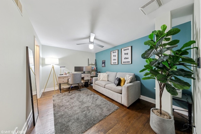 living room with dark wood-type flooring and ceiling fan