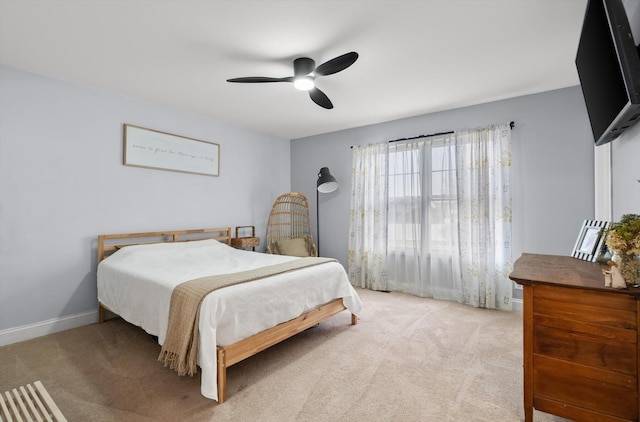 bedroom with light carpet and ceiling fan