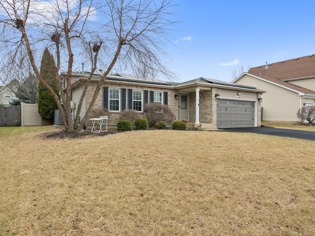 single story home with a garage and a front lawn