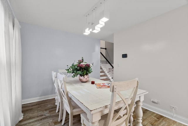 dining room with dark hardwood / wood-style floors