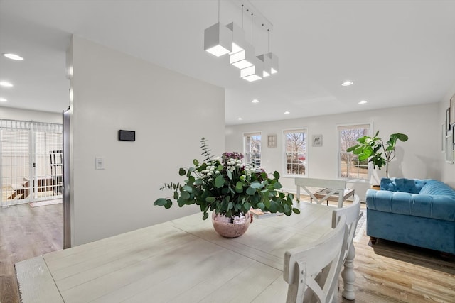 dining space with light wood-type flooring