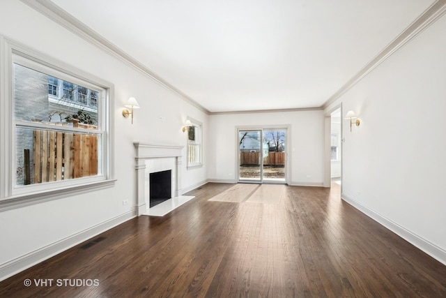 unfurnished living room with hardwood / wood-style floors and ornamental molding