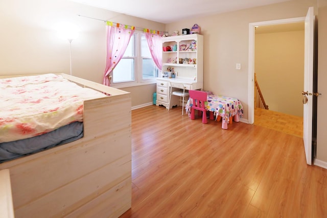 bedroom featuring wood-type flooring