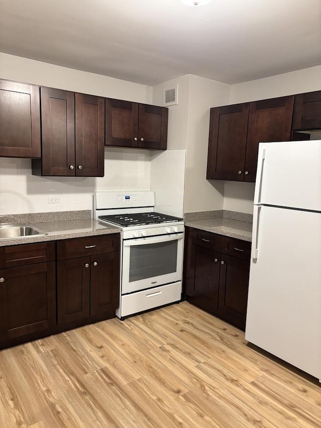 kitchen featuring dark brown cabinets