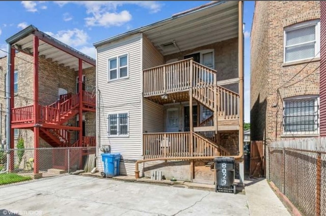 rear view of property with a balcony