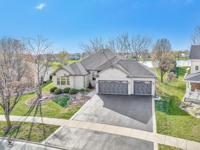 1401 Rolling Pass, Beecher, IL 60401 - french country home featuring asphalt driveway, a garage, a front lawn, and a shingled roof