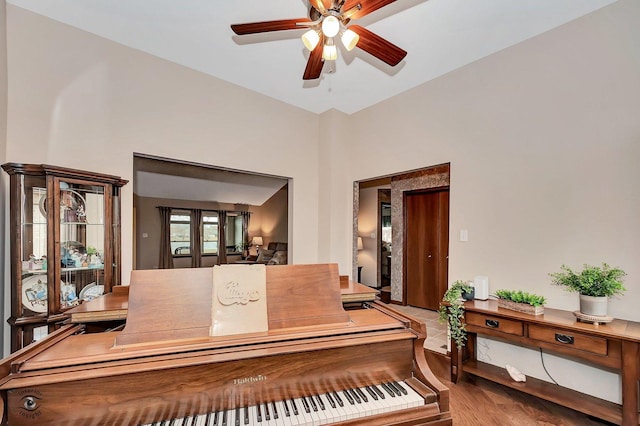 miscellaneous room with wood-type flooring and ceiling fan