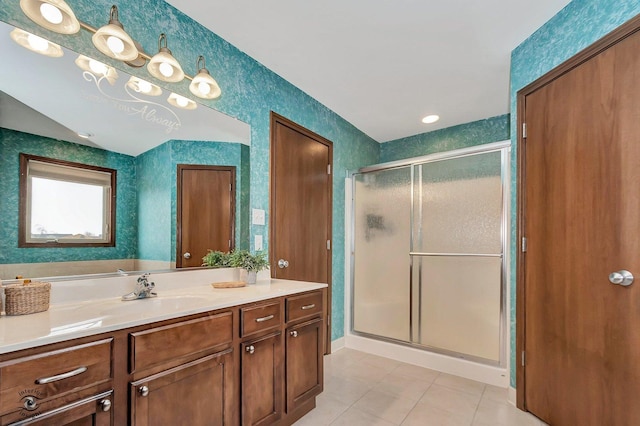 bathroom with vanity, a shower with shower door, and tile patterned flooring