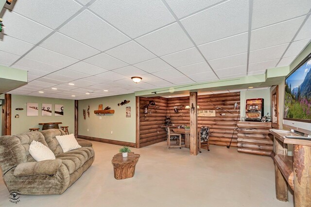 living room with a paneled ceiling