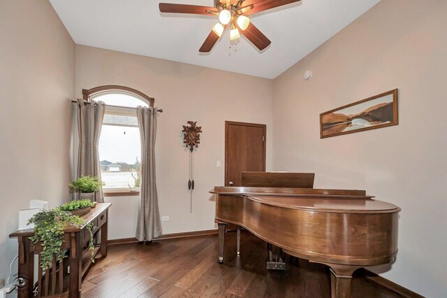 misc room with dark hardwood / wood-style floors and ceiling fan