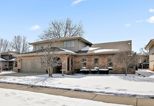 traditional-style home with brick siding and driveway