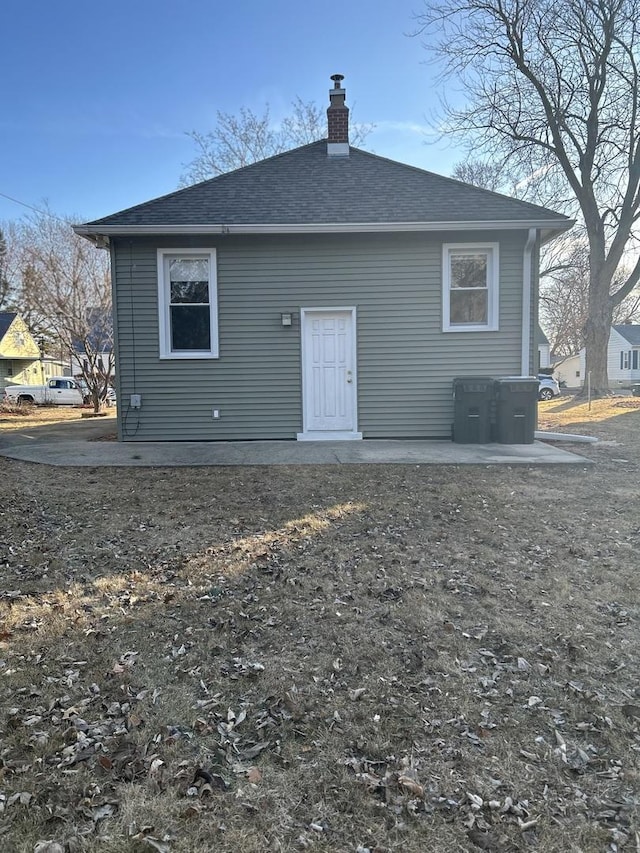 back of property with a patio area