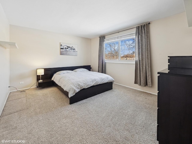 bedroom featuring carpet floors and baseboards