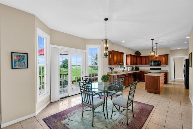 dining area with light tile patterned floors, recessed lighting, and baseboards