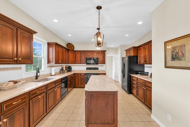 kitchen featuring black appliances, light tile patterned flooring, a kitchen island, and a sink