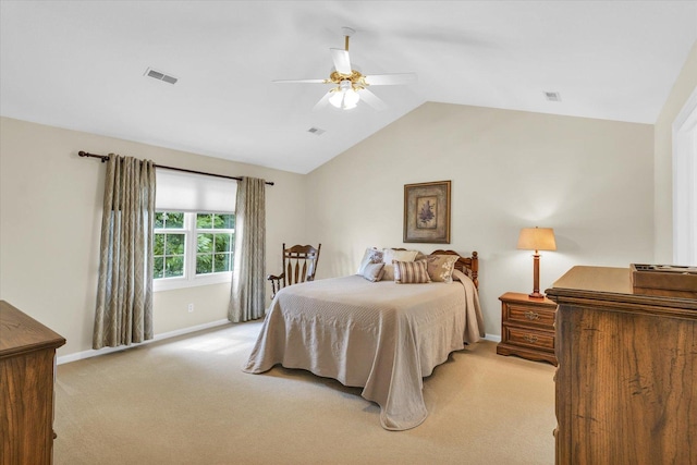 bedroom with a ceiling fan, visible vents, baseboards, lofted ceiling, and light colored carpet