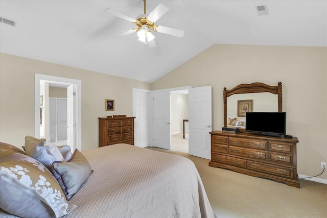 bedroom with vaulted ceiling, carpet, and visible vents