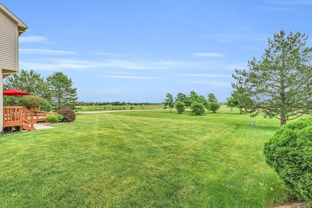 view of yard featuring a wooden deck