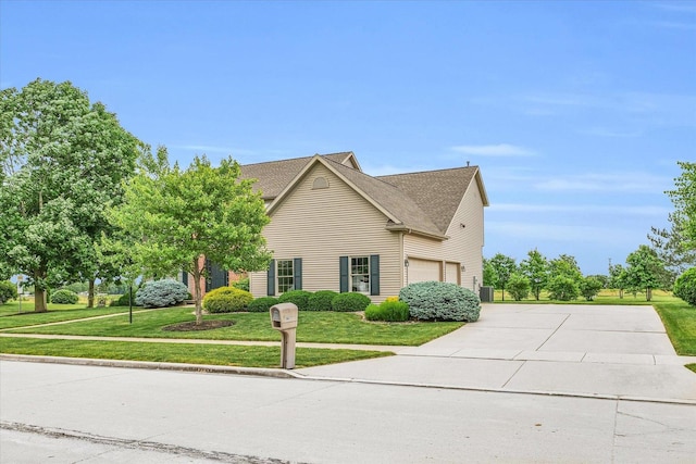 view of property exterior with an attached garage, a yard, and driveway