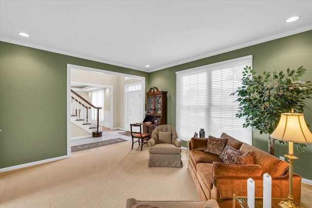 carpeted living room with stairs, baseboards, and ornamental molding