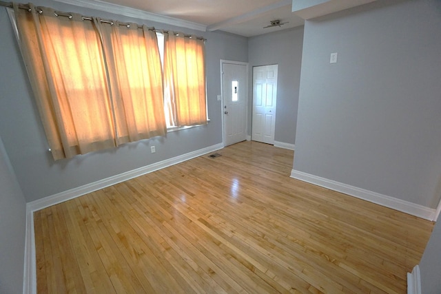 spare room with light hardwood / wood-style flooring