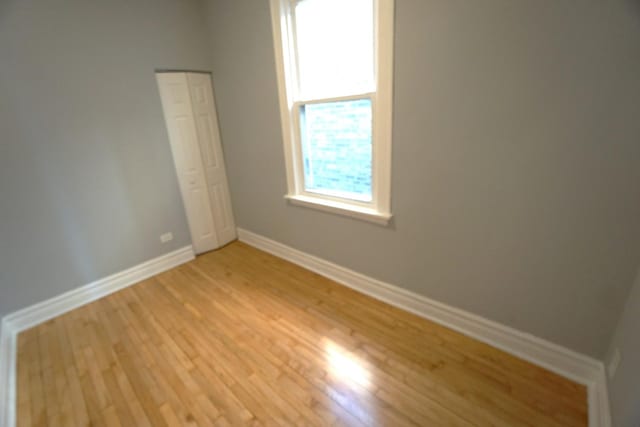 spare room with light hardwood / wood-style flooring