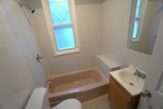 full bathroom with vanity, plenty of natural light, tile walls, and toilet