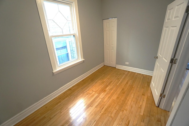 spare room with light hardwood / wood-style floors