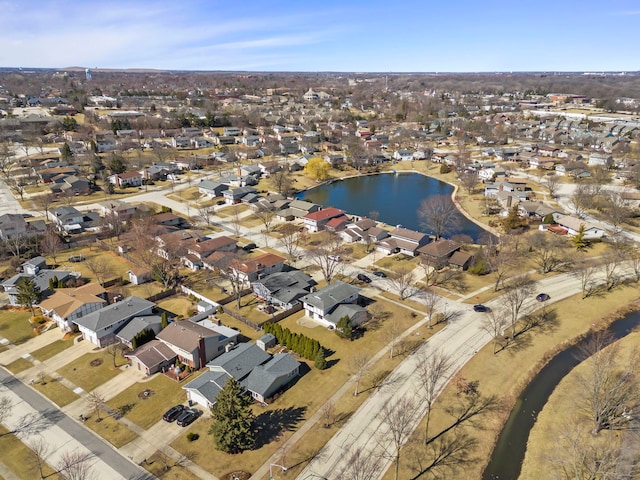 birds eye view of property with a water view and a residential view