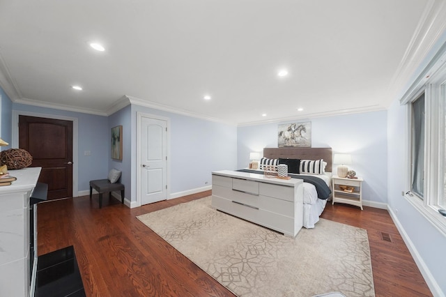 bedroom with crown molding and hardwood / wood-style flooring