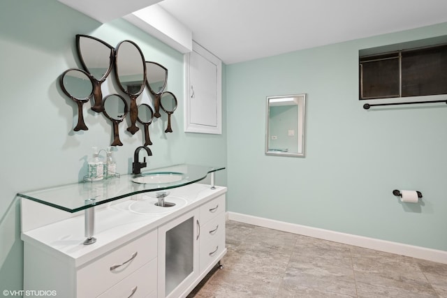 interior space featuring white cabinetry and sink