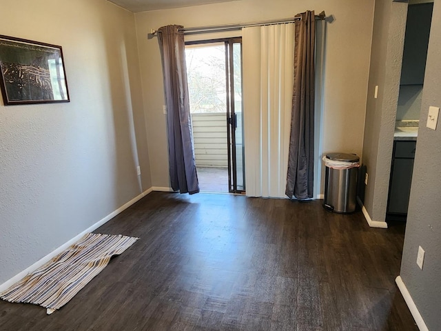 unfurnished room featuring dark hardwood / wood-style floors