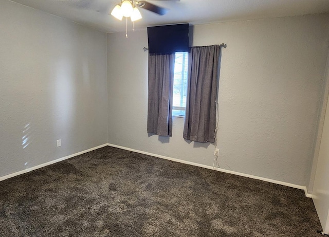 spare room featuring carpet floors and ceiling fan