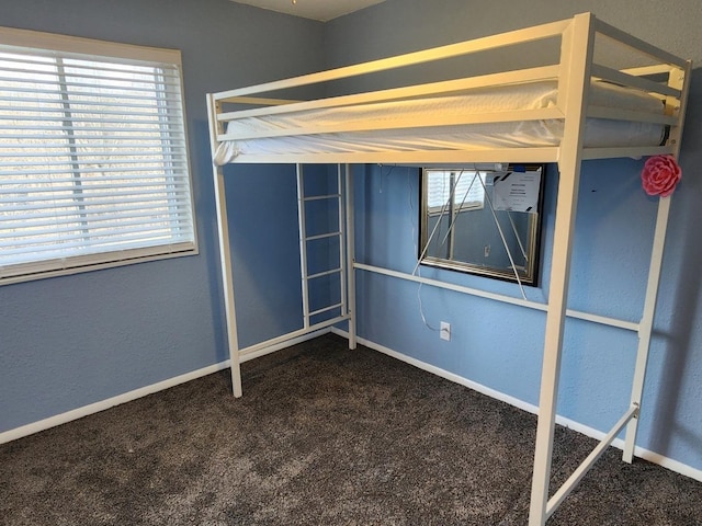 unfurnished bedroom with carpet flooring