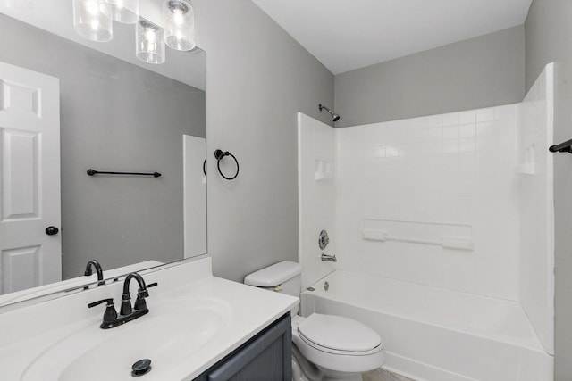 full bathroom featuring vanity, washtub / shower combination, and toilet