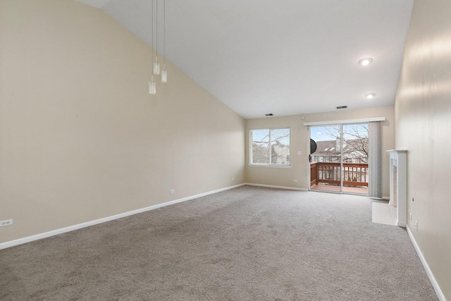 unfurnished living room featuring lofted ceiling and carpet flooring