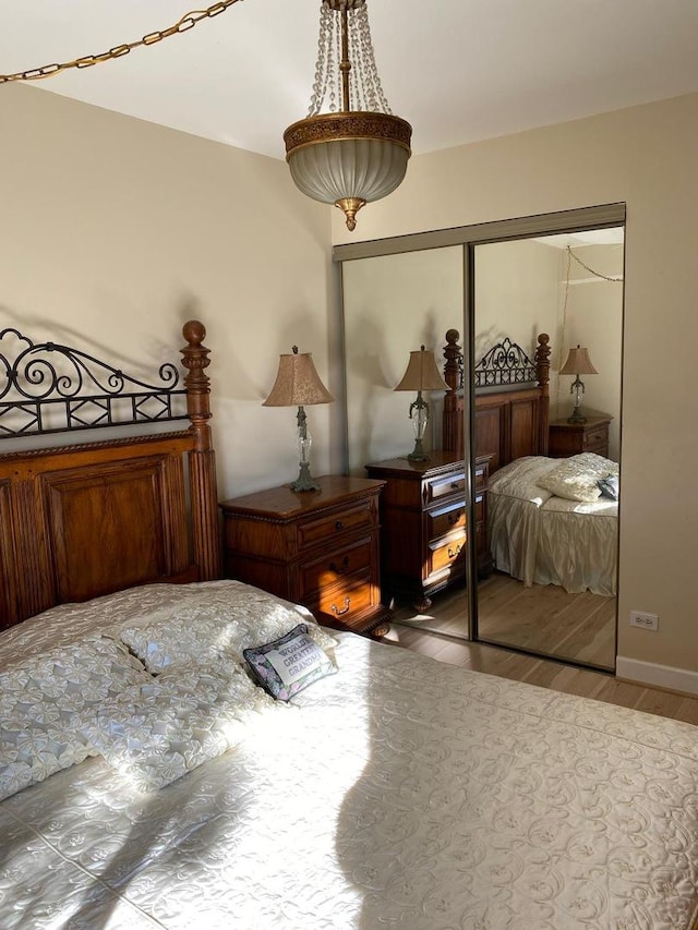 bedroom featuring a closet and wood finished floors