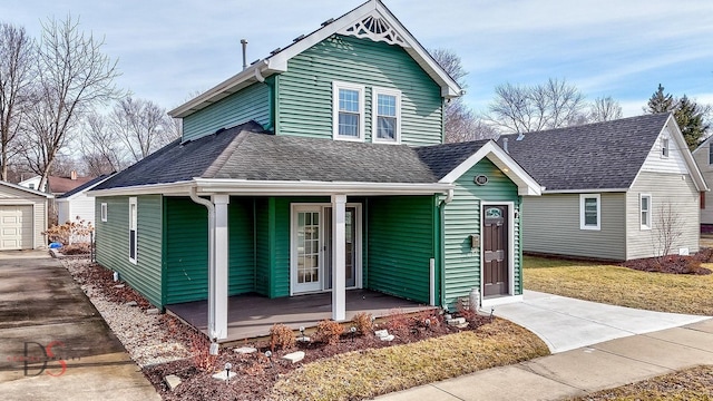 view of front facade with a garage and a porch