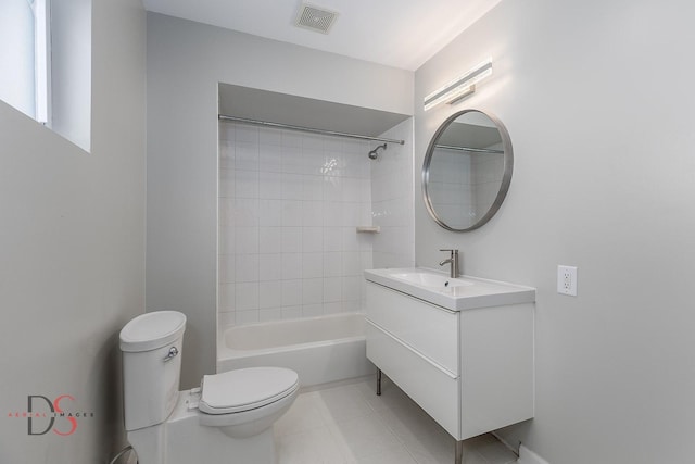 full bathroom with tiled shower / bath combo, vanity, tile patterned flooring, and toilet