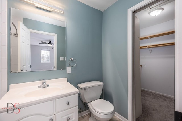 bathroom with vanity, ceiling fan, and toilet