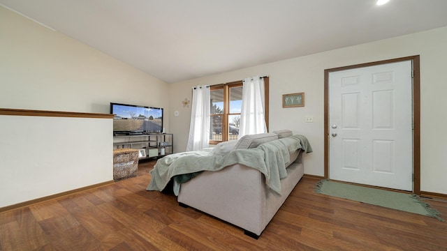 living room with hardwood / wood-style flooring and lofted ceiling