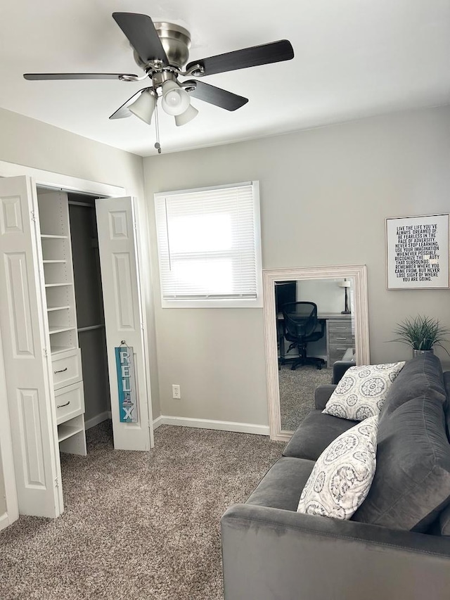 carpeted living room with ceiling fan