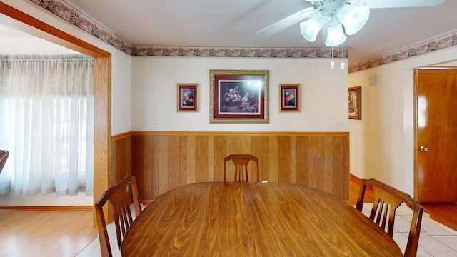 unfurnished dining area featuring ceiling fan and light tile patterned floors