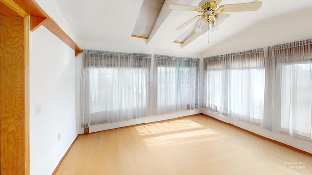 unfurnished sunroom with lofted ceiling and ceiling fan